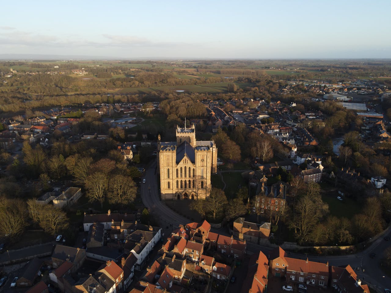 private-party-01 Stunning aerial view of Ripon Cathedral, a historical landmark in Yorkshire, surrounded by countryside.